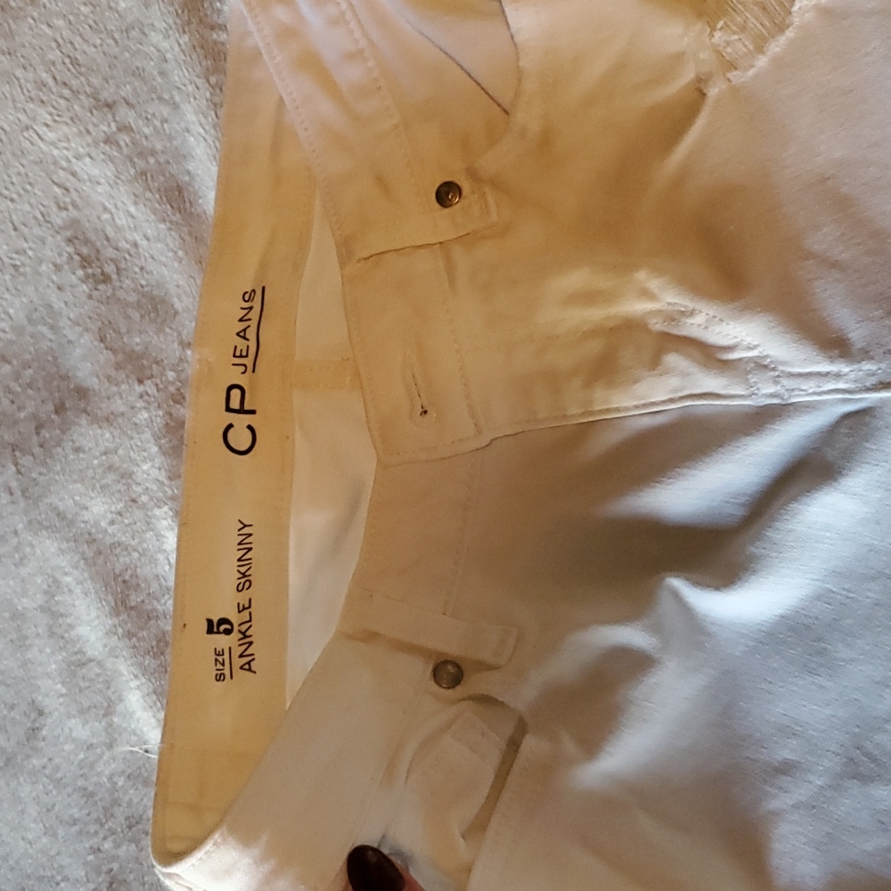 Distressed white jeans